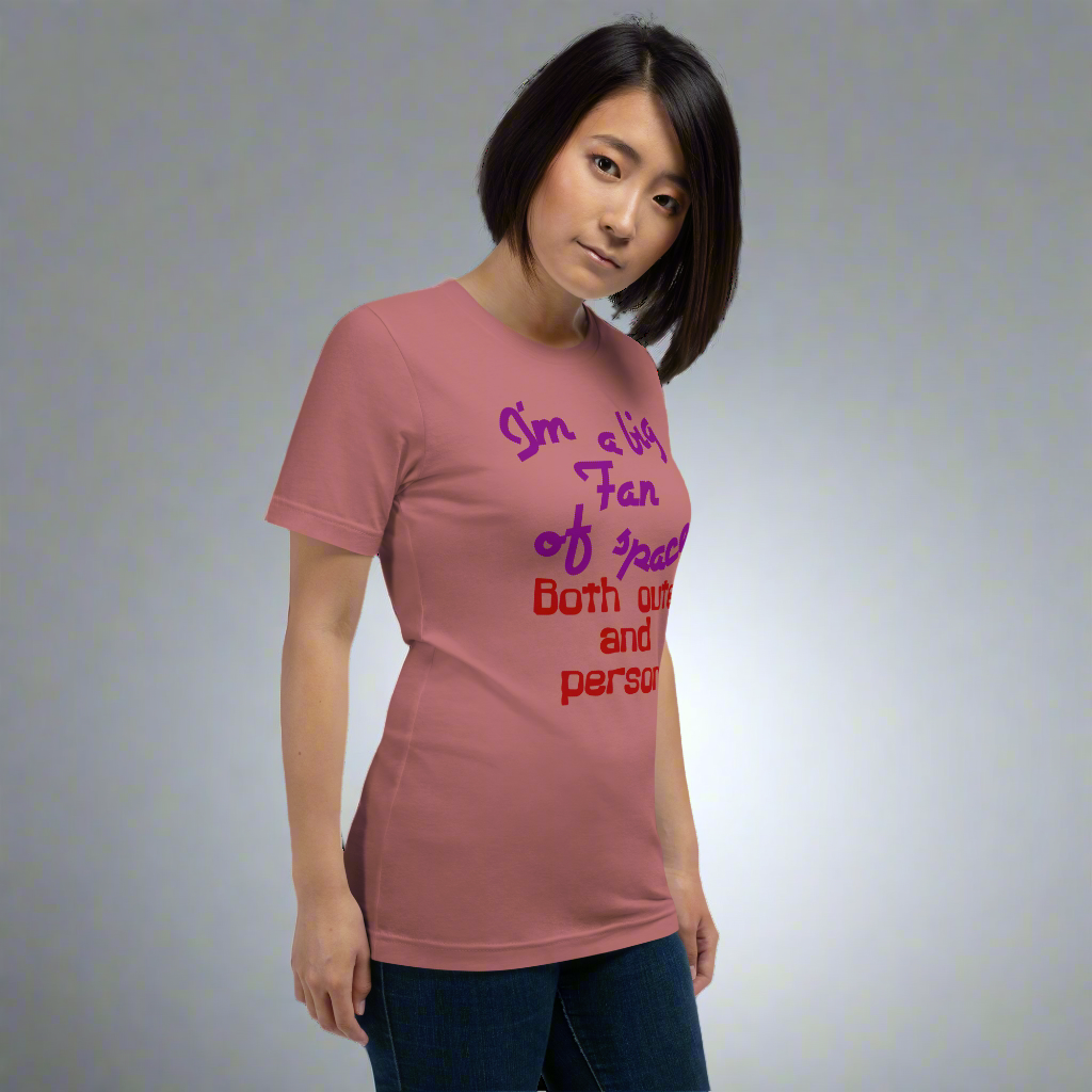 Unisex t-shirt featuring the phrase "I'm a Big Fan of Space, Both Outer and Personal" in vibrant text, ideal for astronomy enthusiasts and introverts.