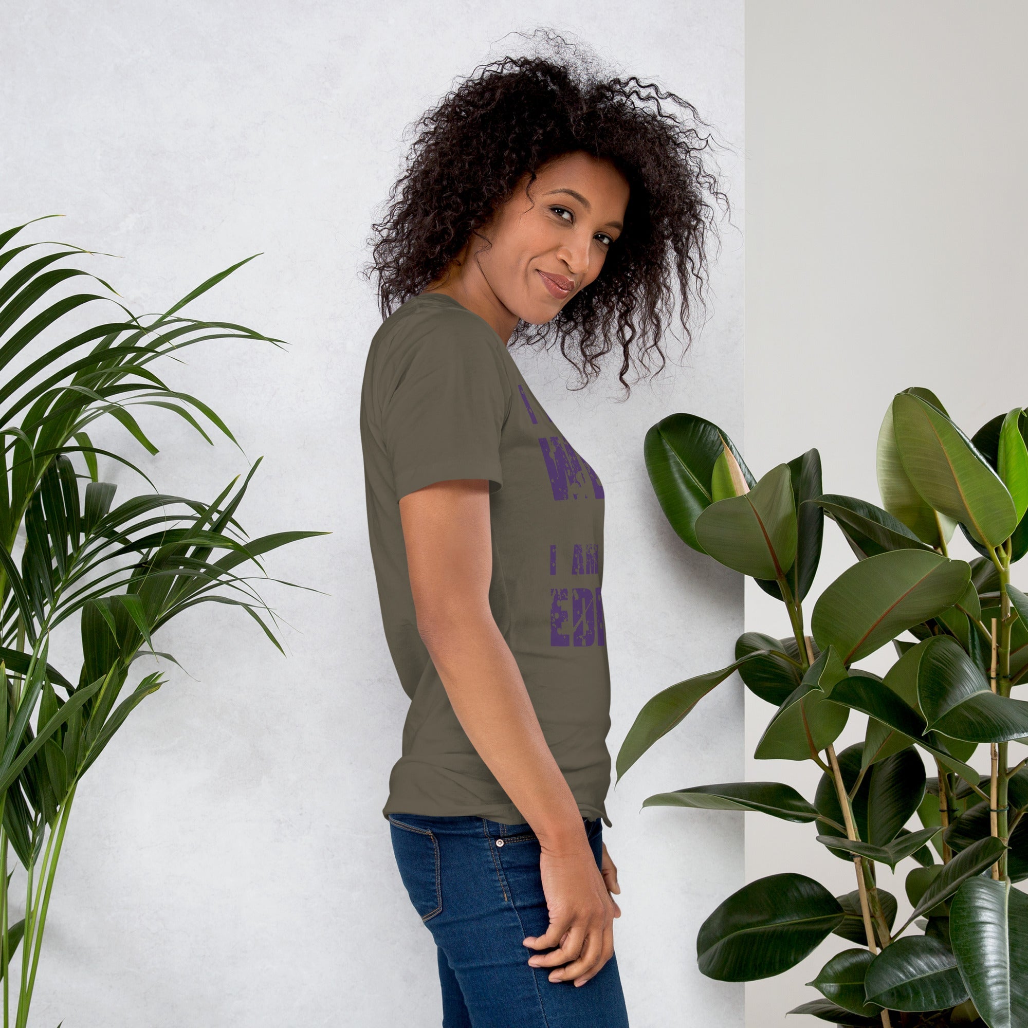 Unisex t-shirt with "I am not Weird" in purple text worn by a person, comfortable fit.