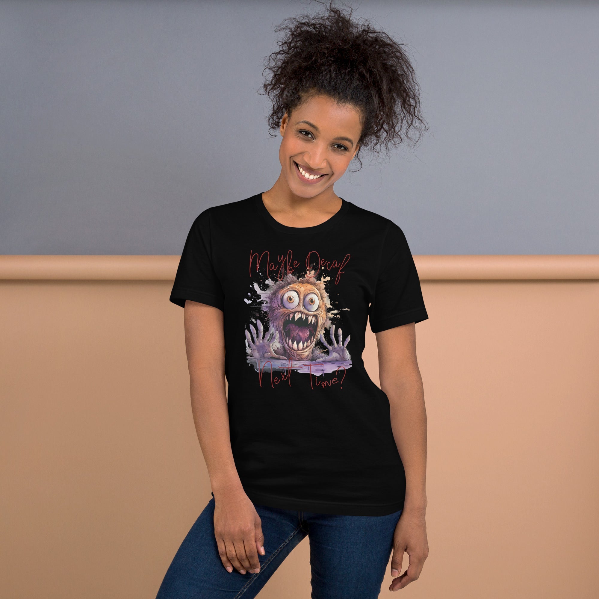 Unisex t-shirt with monster print and text "Perhaps Decaf Next Time?" on black fabric.