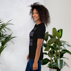 Unisex t-shirt with "I am not Weird" in purple text, worn by model, side view.