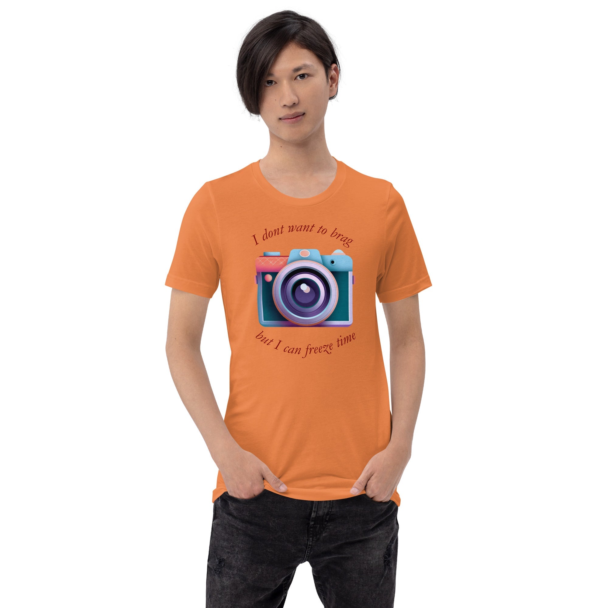 Unisex t-shirt with "I don't want to brag, but I can freeze time" camera graphic, orange.