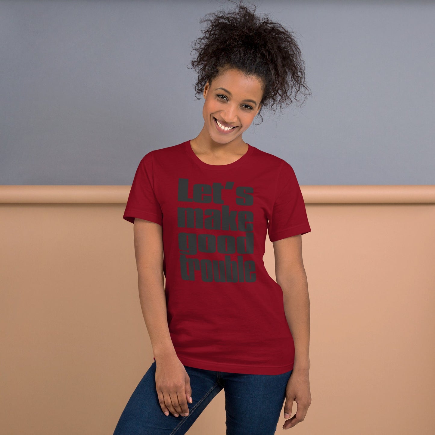 Unisex black t-shirt with "Let's make good trouble" design, inspired by Senator Cory Booker's quote, promoting progressive causes.