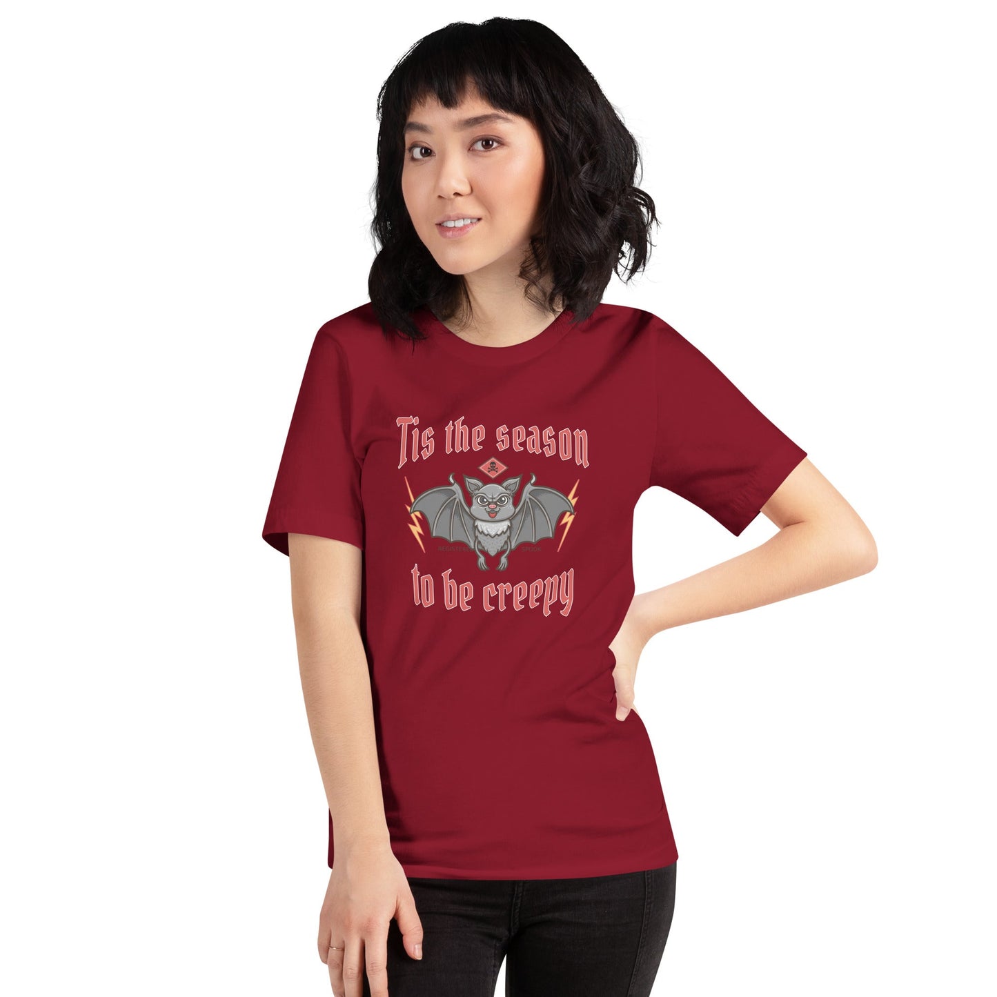 Halloween-themed unisex t-shirt featuring a creepy bat graphic on a maroon background.