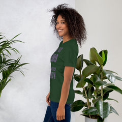 Unisex t-shirt with "I am not Weird" in purple text, model side view.