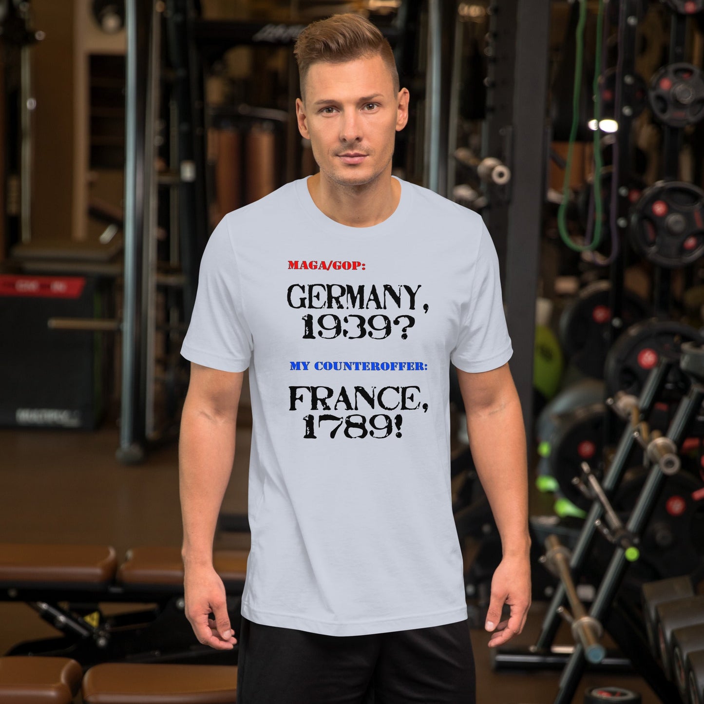 Unisex t-shirt featuring Germany and France historical references, worn in gym setting.