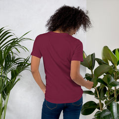 Unisex "I am not Weird" purple t-shirt shown from the back, highlighting comfortable fit.
