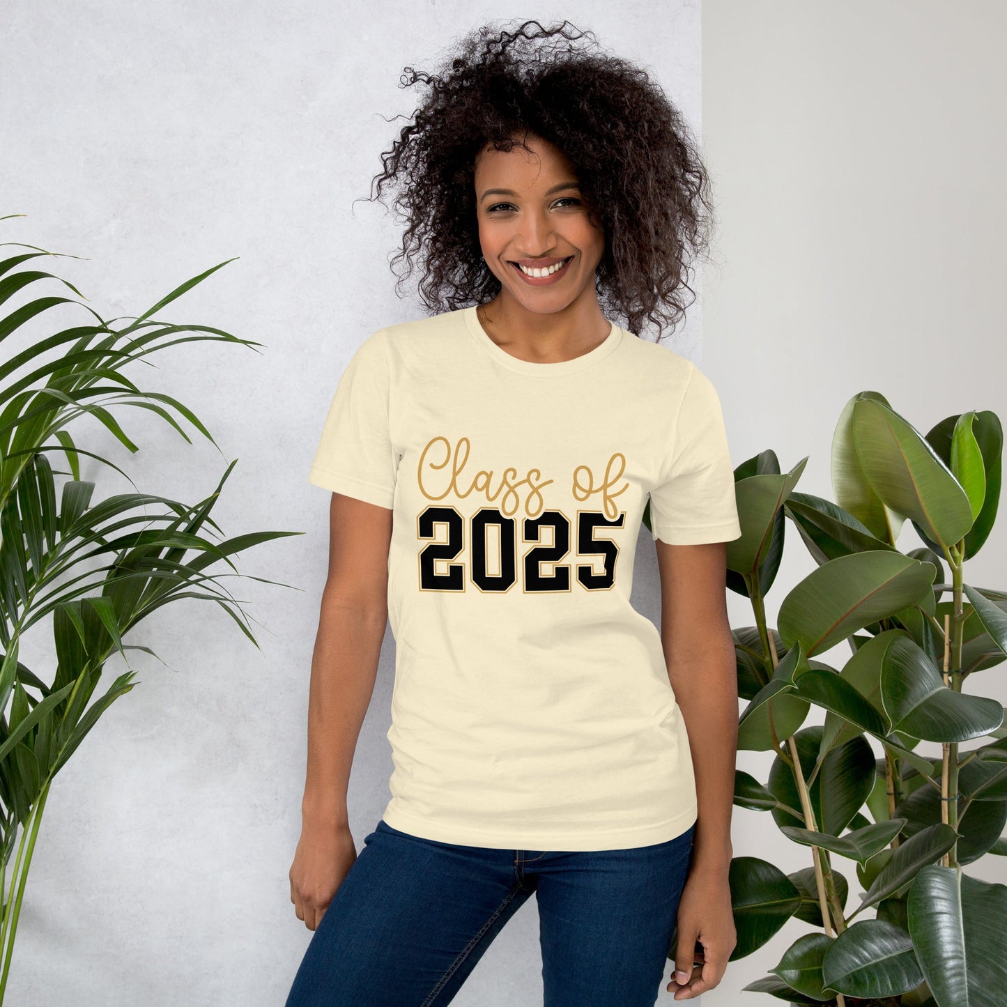 Class of 2025 unisex t-shirt, soft and lightweight, worn by a person standing near plants.