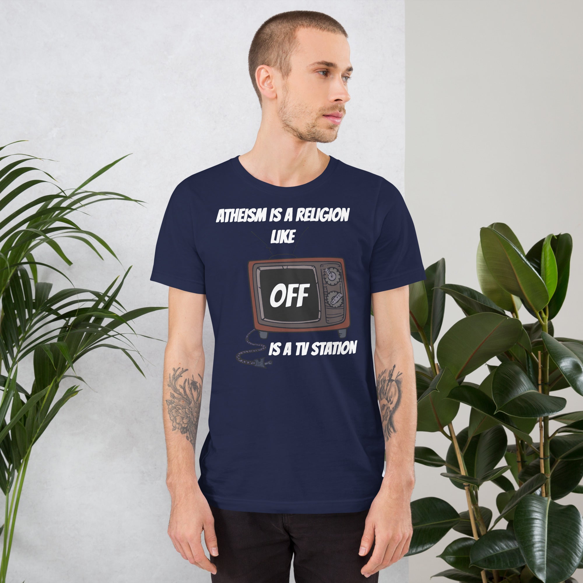 White unisex t-shirt with "Atheism is a religion like OFF is a TV station" design.