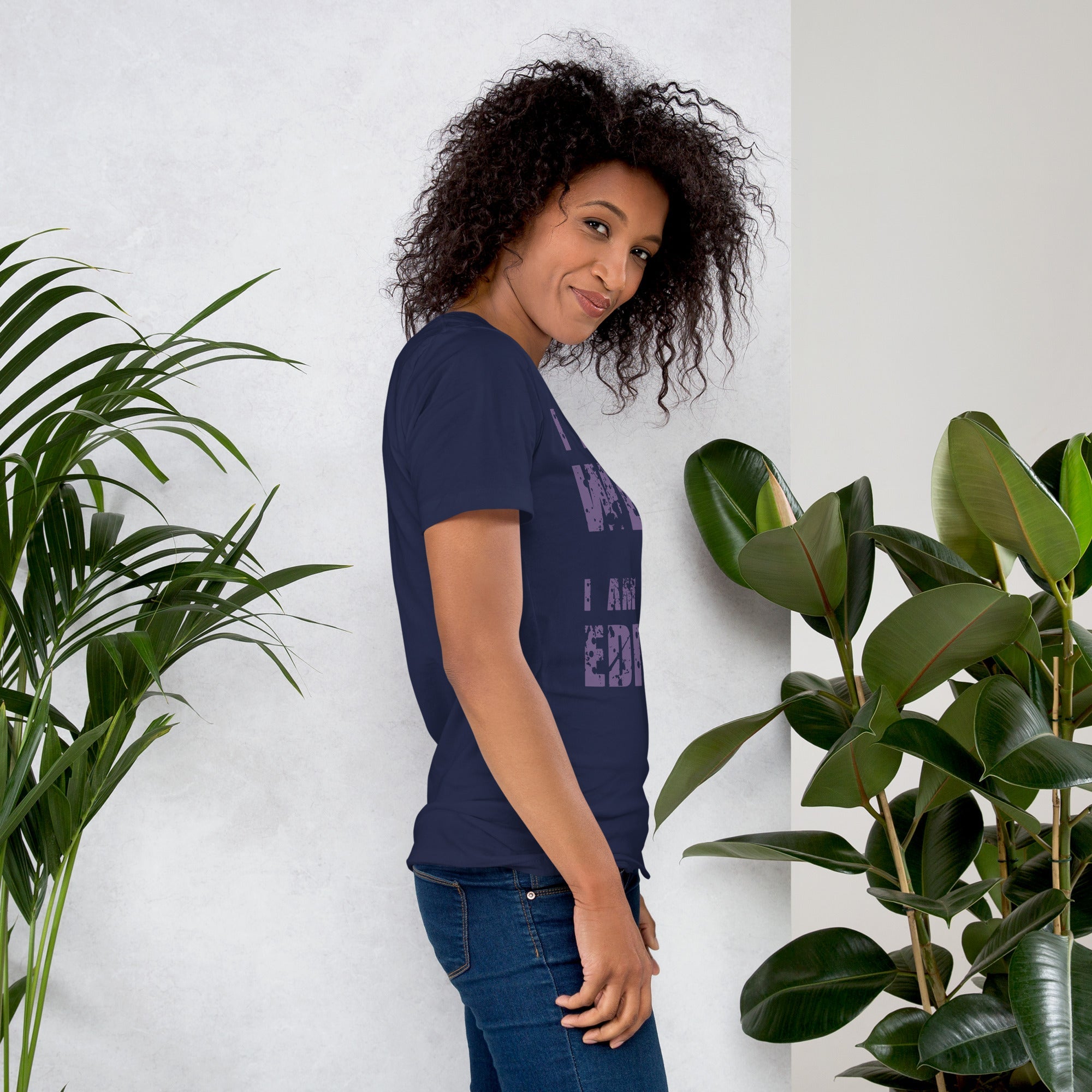 Unisex t-shirt with "I am not Weird" in purple text, worn by a person, emphasizing uniqueness and comfort.