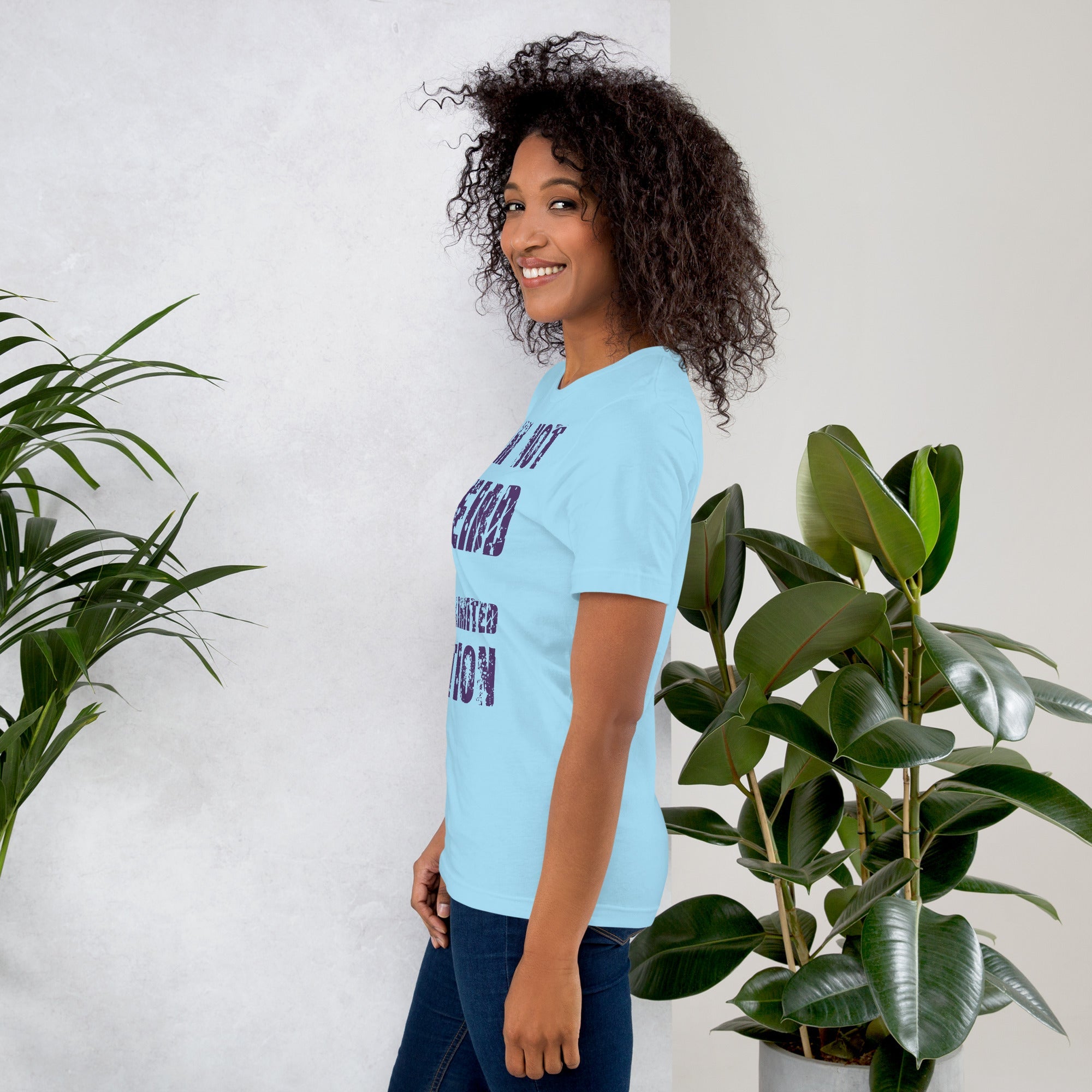 Unisex t-shirt with "I am not Weird" purple text, soft blue fabric, perfect for unique styles.