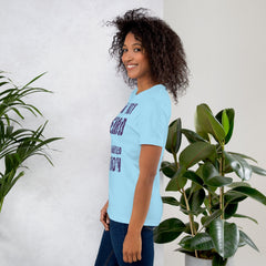 Unisex t-shirt with "I am not Weird" purple text, soft blue fabric, perfect for unique styles.