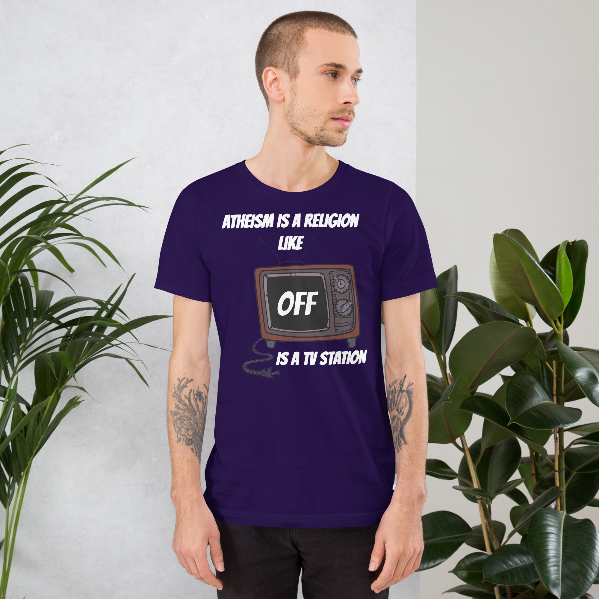 White unisex t-shirt with "Atheism is a religion like OFF is a TV station" design.