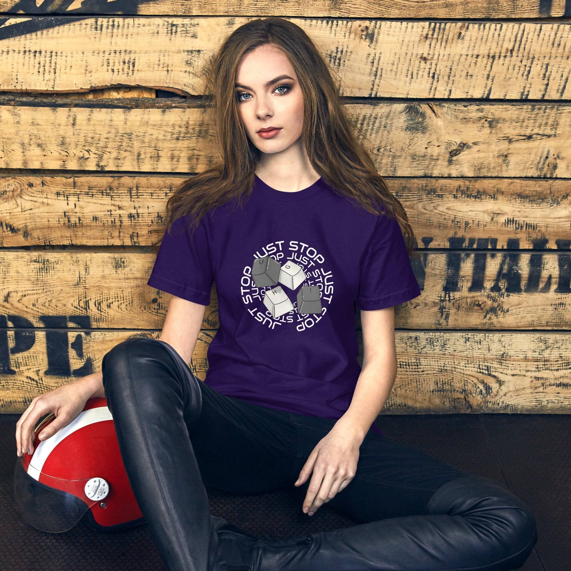Unisex t-shirt with "Just Stop" key caps design, purple color, casual wear.