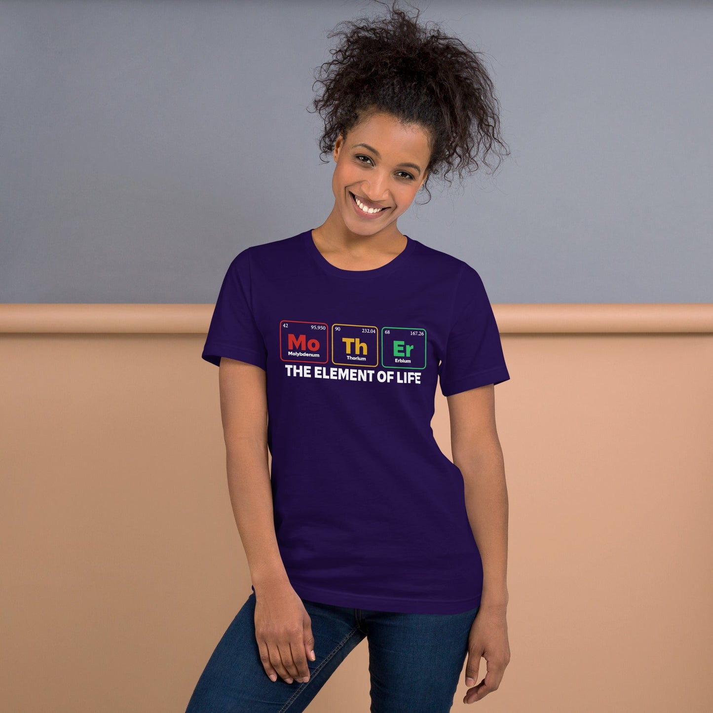 Unisex t-shirt with "Mother - the Element of Life" design, dark color, worn by smiling person.