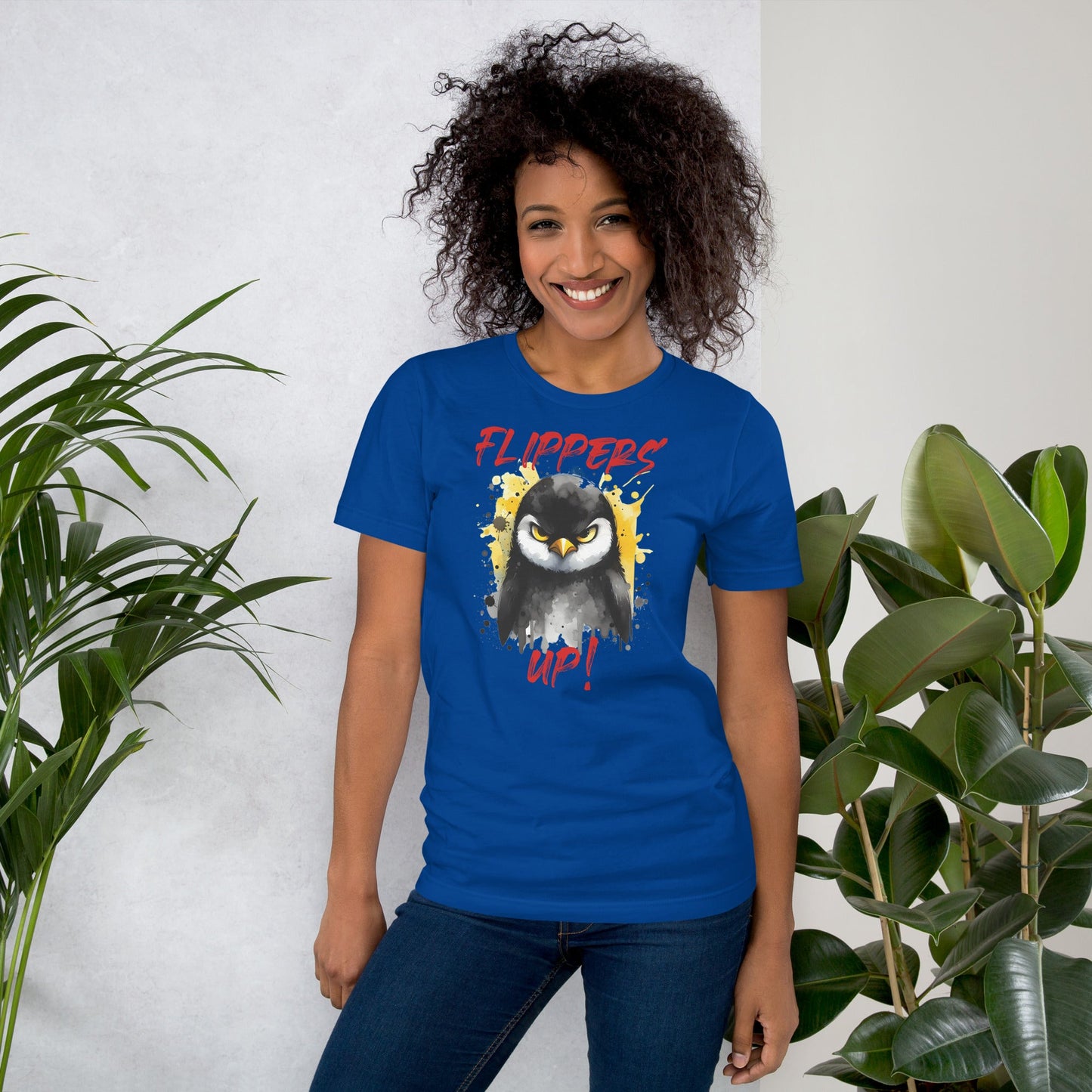 Unisex blue t-shirt featuring "Flippers Up" design with penguin graphic, soft and lightweight fit.