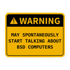 Retro OS warning sticker that says "May Spontaneously Start Talking..." for tech enthusiasts