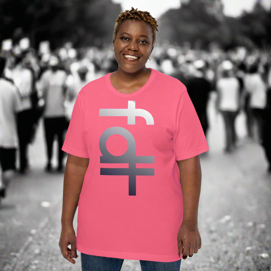 Unisex model wearing a pink FDT portrait t-shirt with bold graphic text, in a crowd scene.
