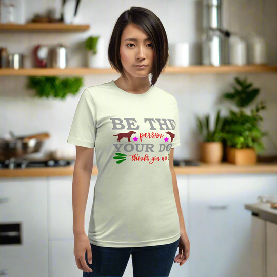 Unisex t-shirt with "Be the person your dog thinks you are" message, soft and lightweight fit.