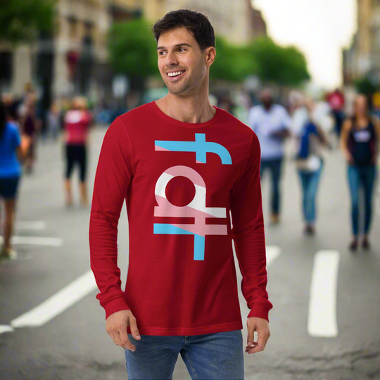 Unisex long sleeve tee with "fdt" text in trans flag colors worn by a smiling person in an urban setting.