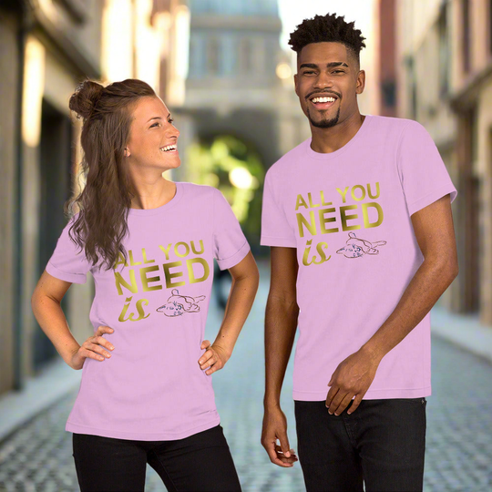 Unisex t-shirt with "All you need is cats" design, worn by two smiling individuals in a casual, urban setting.