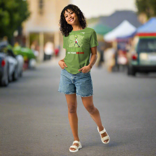 Vegan zombies themed women's relaxed t-shirt, green, features "Hide Your Grains" slogan, worn by woman outdoors.