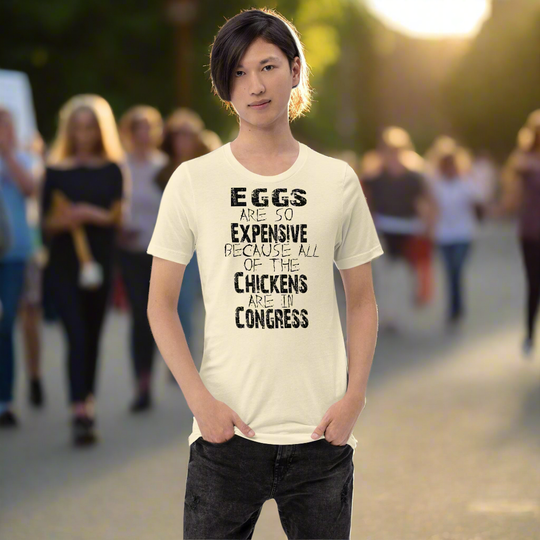 Black unisex t-shirt with "Eggs are so expensive because all of the chickens are in Congress" text.
