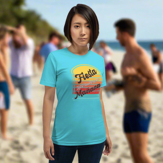 Unisex t-shirt with "Fiesta like there is no Mañana" design, casual beach setting.