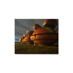 Luminescent metal print of three orange life rafts at the Corpus Christi Trade Center