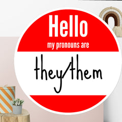 Round Hello My Name Is sticker with They/Them pronouns in red and white retro design