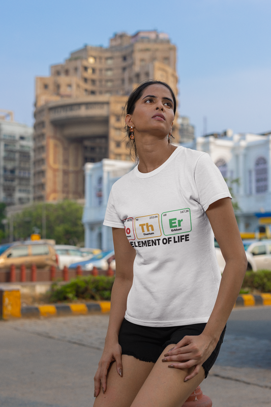 Light unisex t-shirt with "Mother - the Element of Life" design, worn outdoors.