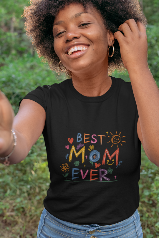 Best Mom Ever women's relaxed t-shirt with colorful text design, worn by a smiling person outdoors.
