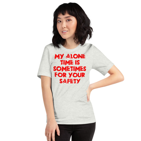 Red unisex t-shirt with humorous text "My alone time is sometimes for your safety," worn by a model.