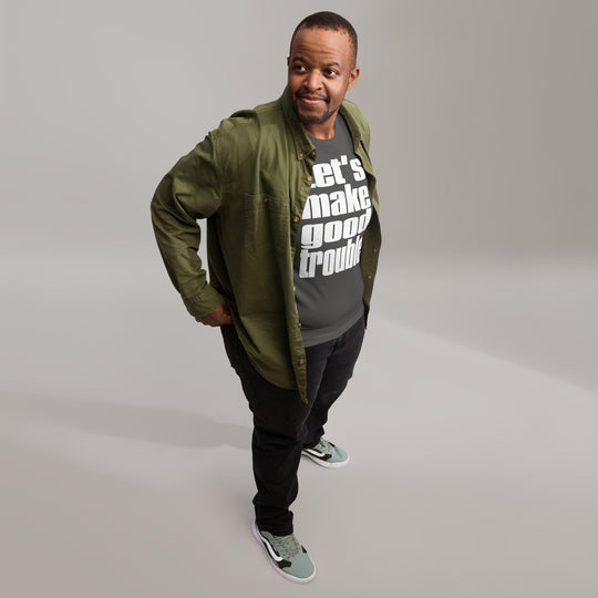 Unisex t-shirt with "Let's make good trouble" quote, inspired by Senator Cory Booker's speech, in a casual setting.