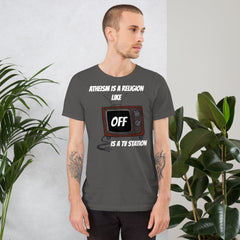 White unisex t-shirt with "Atheism is a religion like OFF is a TV station" slogan, worn by a man.