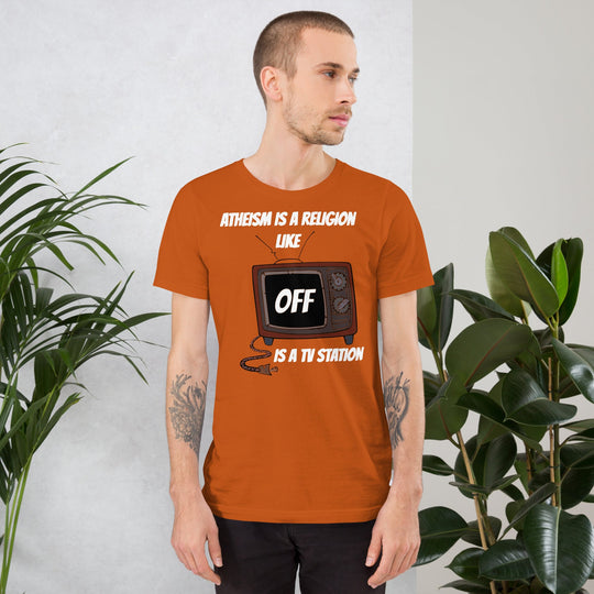 White unisex t-shirt with "Atheism is a religion like OFF is a TV station" text and TV design, soft and lightweight.