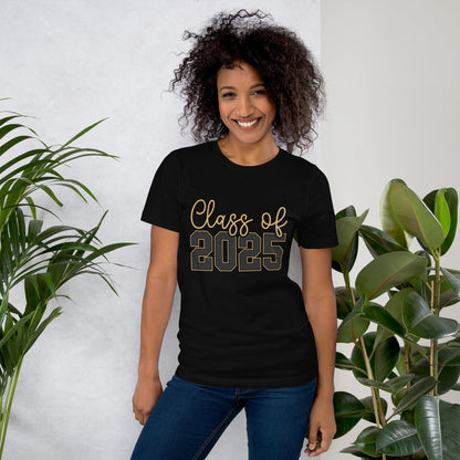 Class of 2025 unisex t-shirt with gold lettering worn by a smiling person standing indoors.
