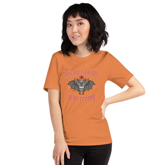 Unisex Halloween t-shirt with "Tis the season to be creepy" design featuring a bat graphic.