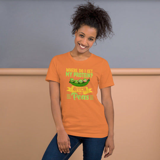 Unisex t-shirt with "Where do I get my protein? Bitch, Peas" design in vibrant colors, worn by person.