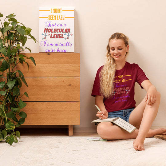 Unisex t-shirt with "I Might Seem Lazy" design, soft and lightweight fabric, model sitting with book.