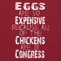 Unisex t-shirt with "Eggs are so expensive because all of the chickens are in Congress" text design.