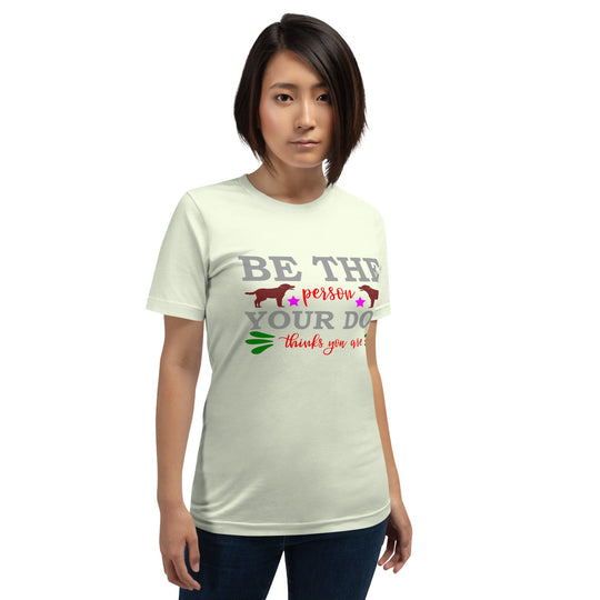 Unisex t-shirt with "Be the person your dog thinks you are" slogan, soft cotton fabric.