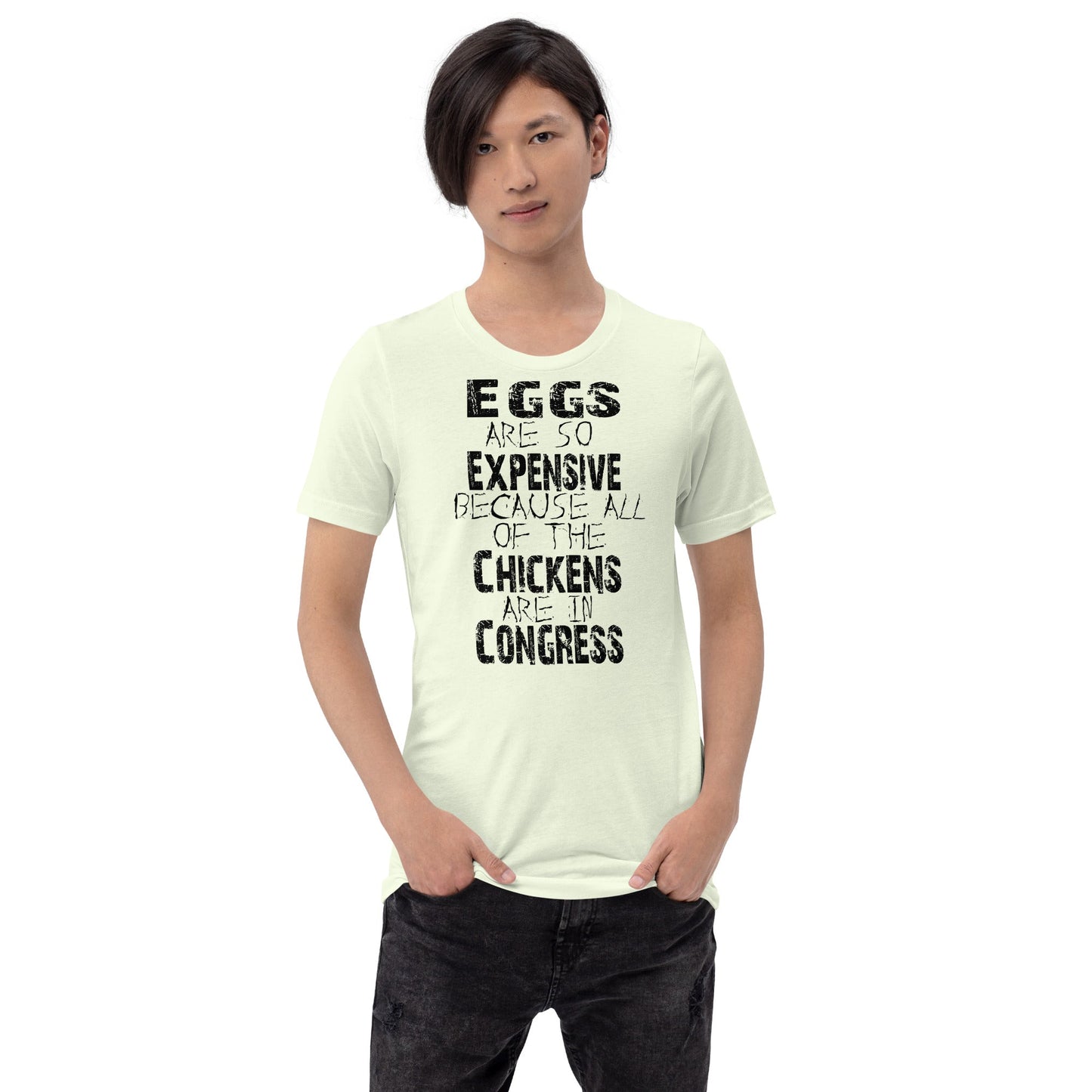 Black unisex t-shirt with "Eggs are so expensive because all of the chickens are in Congress" text, worn by a model.
