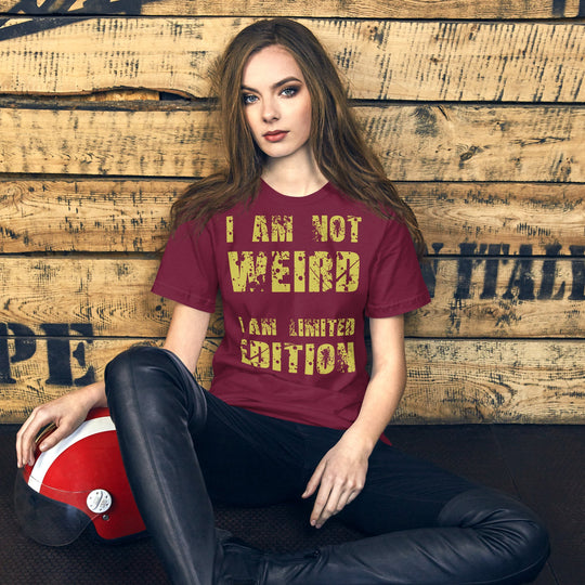 Unisex t-shirt with "I Am Not Weird" yellow text design, soft lightweight feel.
