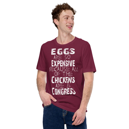 Unisex t-shirt with "Eggs are so expensive because all of the chickens are in Congress" text, humorous design.