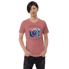 Unisex t-shirt with "I don't want to brag, but I can freeze time" camera graphic, worn by a model.