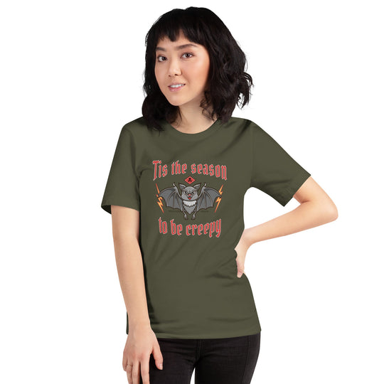Unisex t-shirt with "Tis the season to be creepy" design, featuring a bat graphic.