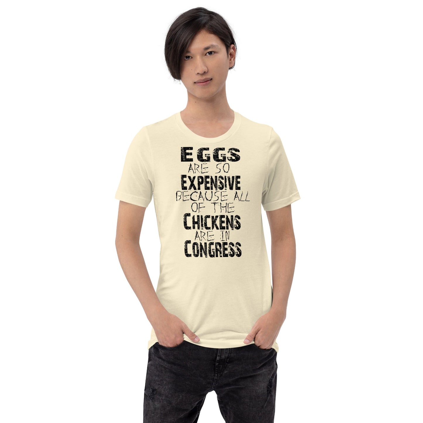 Black unisex t-shirt with "Eggs are so expensive because all of the chickens are in Congress" graphic.