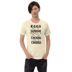 Black unisex t-shirt with "Eggs are so expensive because all of the chickens are in Congress" graphic.