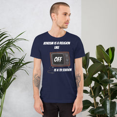 White unisex t-shirt with "Atheism is a religion like OFF is a TV station" design.
