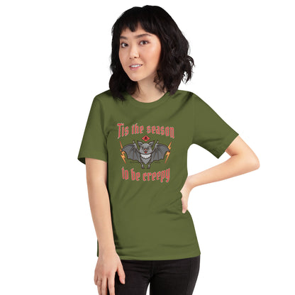 Unisex t-shirt with Halloween theme, featuring "Tis the season to be creepy" text and spooky graphic design.